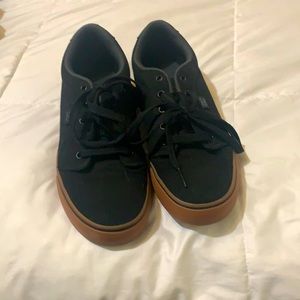 BRAND NEW DC black/gum skate shoes. men’s size 7 women’s size 9